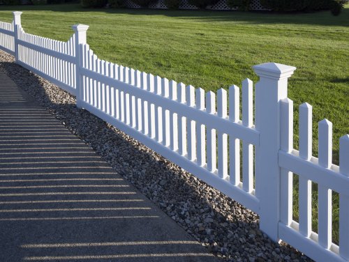 White PVC fence installed for a residential home in Palm Beach County, FL